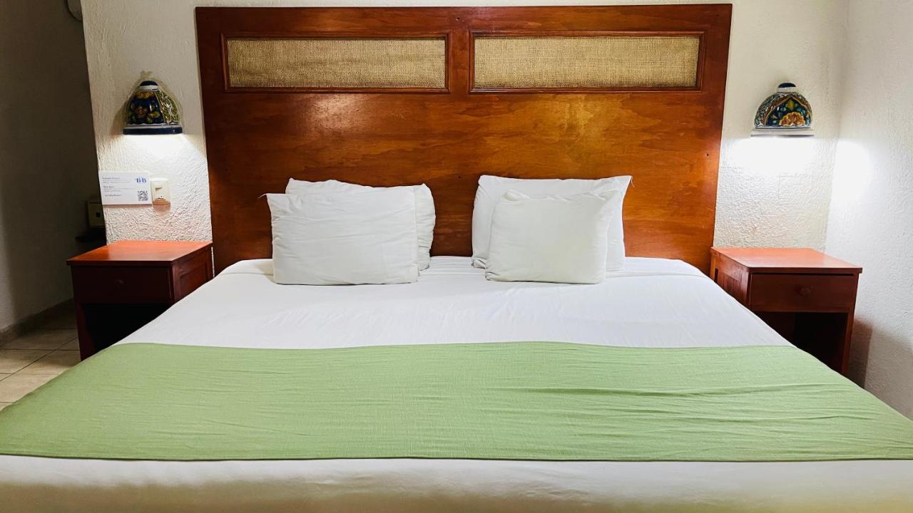 Hotel B&B - 5Th Avenue Playa del Carmen Exterior foto A bed with a green bedsheet